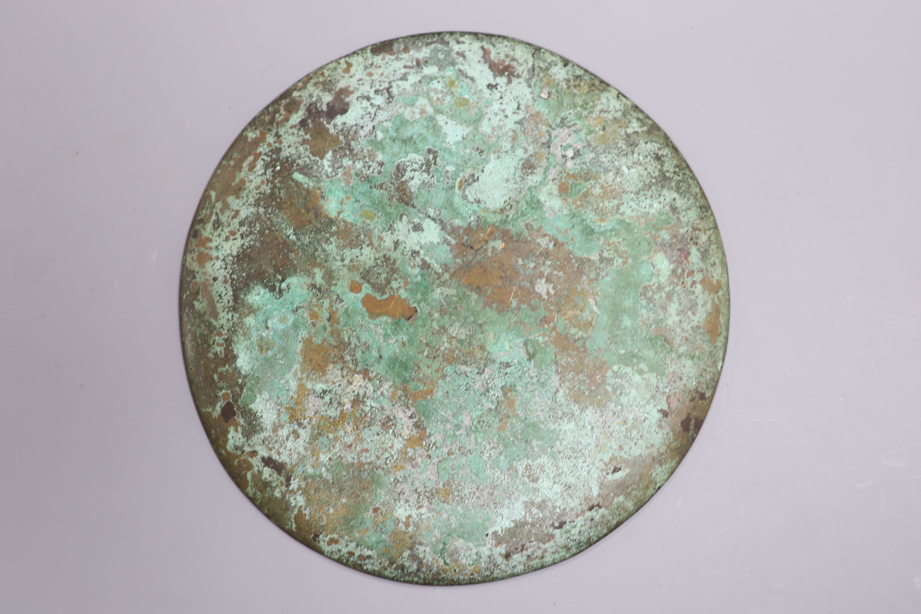 A Greek or Egyptian cast bronze roundel, diameter 18cm